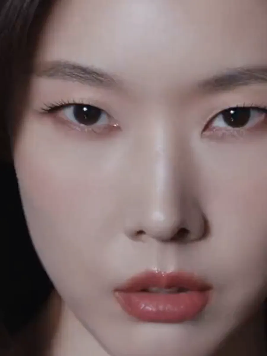 Thermage FLX campaign film — a close portrait lifting to camera on a black and grey studio stage.