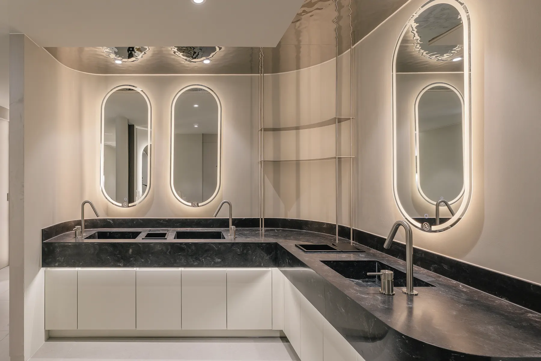 Basins under backlit oval mirrors at THE Beautiful Clinic in Seoul